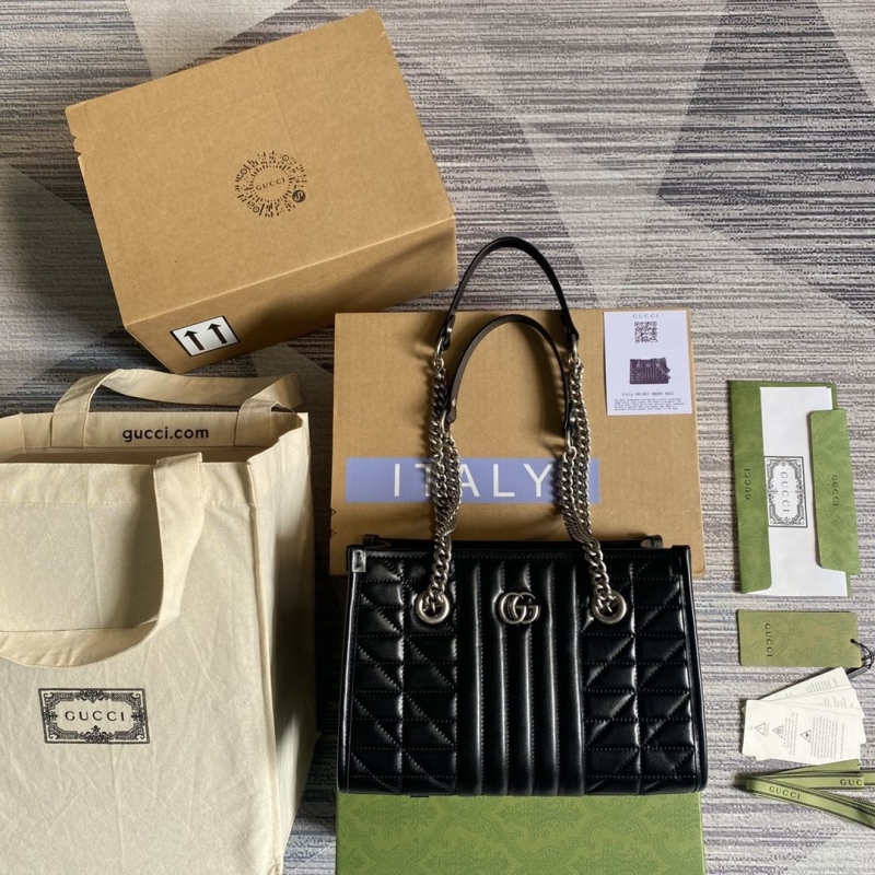 G*u*i shopping bags